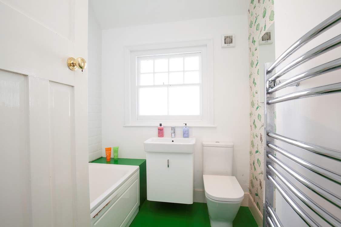 One of two modern bath/shower-rooms.
