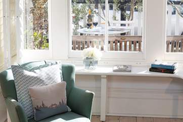 Inviting spaces for quiet time are a delightful feature of this lovely home.