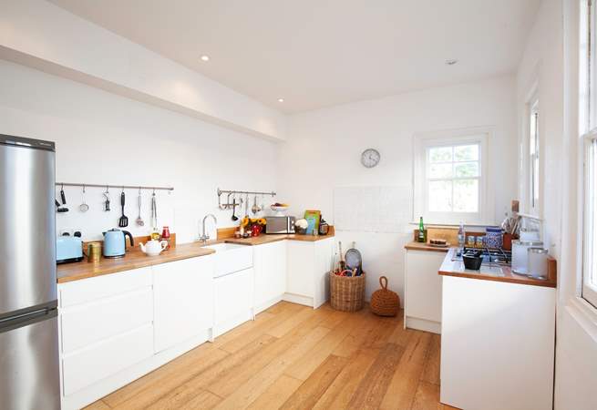 The bright modern kitchen is fully equipped.