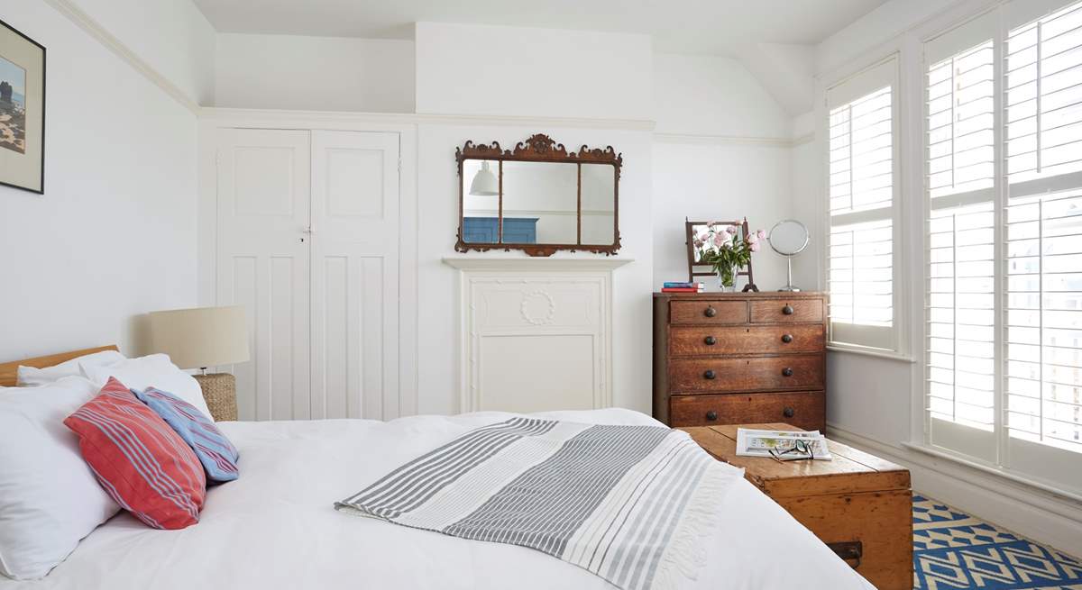 The largest of the bedrooms on the first floor features a king-sized bed.