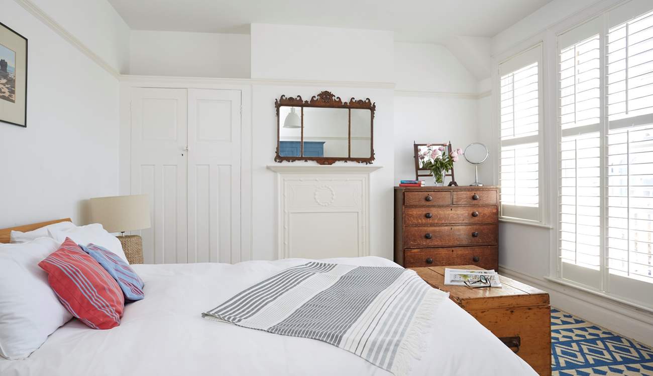 The largest of the bedrooms on the first floor features a king-sized bed.