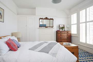 The largest of the bedrooms on the first floor features a king-sized bed.