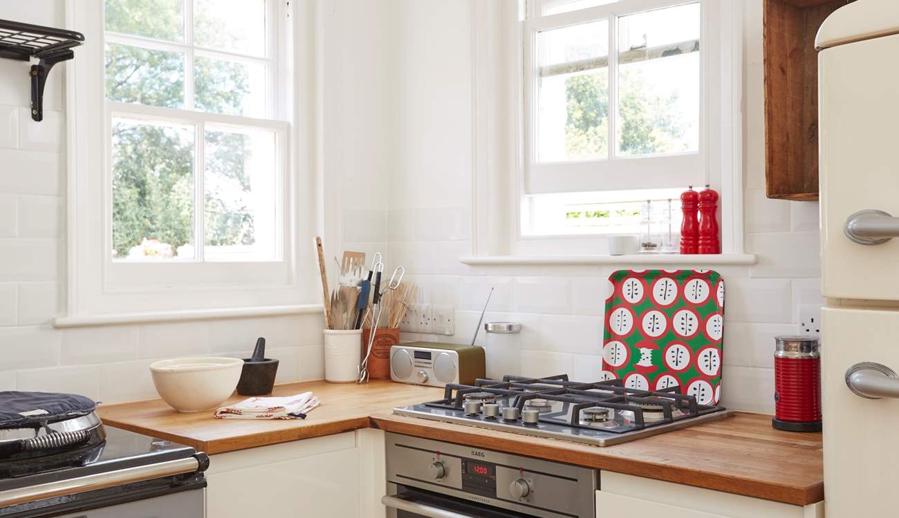 The gas hob and electric oven can be found in one corner of the kitchen. 