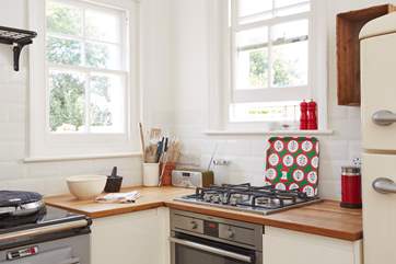 The gas hob and electric oven can be found in one corner of the Kitchen.