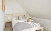 This bedroom in the eaves on the second floor is cosy and bright. - Thumbnail Image