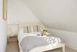 This bedroom in the eaves on the second floor is cosy and bright.