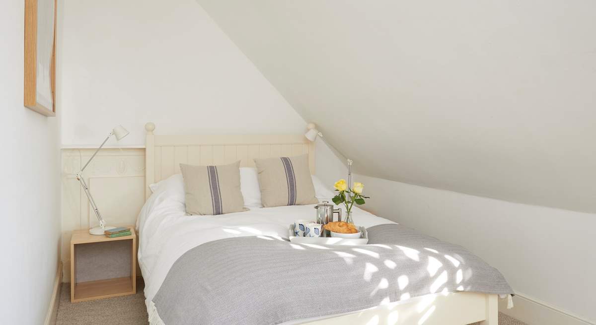 This bedroom in the eaves on the second floor is cosy and bright.