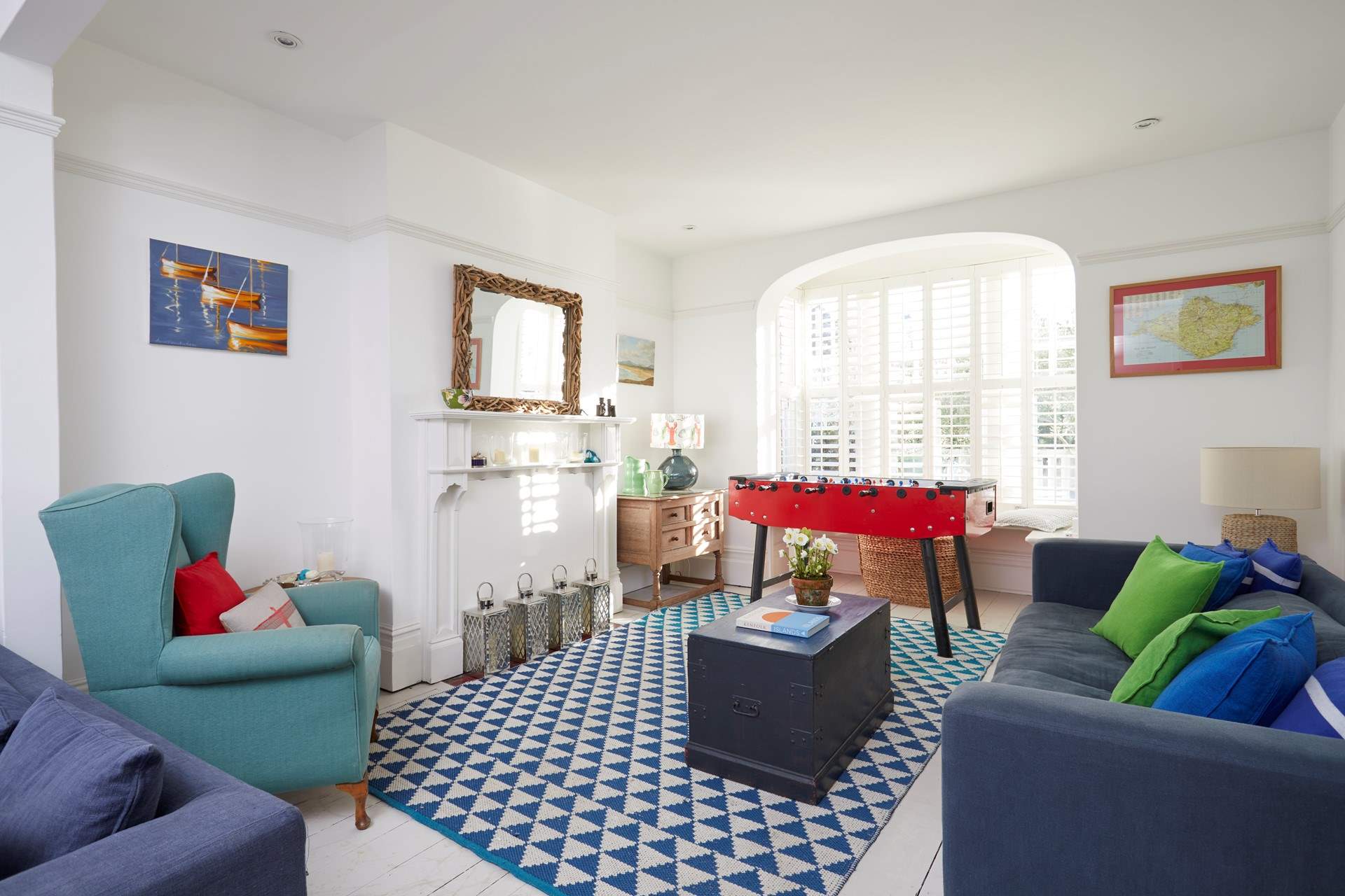 Beautiful period windows to either end of the sitting-room make this a welcoming, light and airy space.