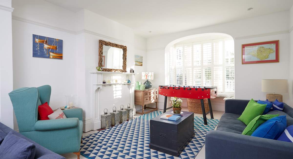 Beautiful period windows to either end of the sitting-room make this a welcoming, light and airy space.