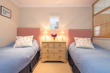 The second twin bedroom has its own television and is located between the other two bedrooms.