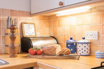Prepare lunch in the galley-style kitchen and picnic in the garden.