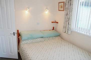 The double bedroom has views out to the grounds.