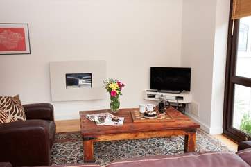 The sitting-area has soft seating for five people.