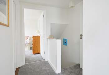 With a bathroom on this level, the first floor leads to a double and single bedroom.