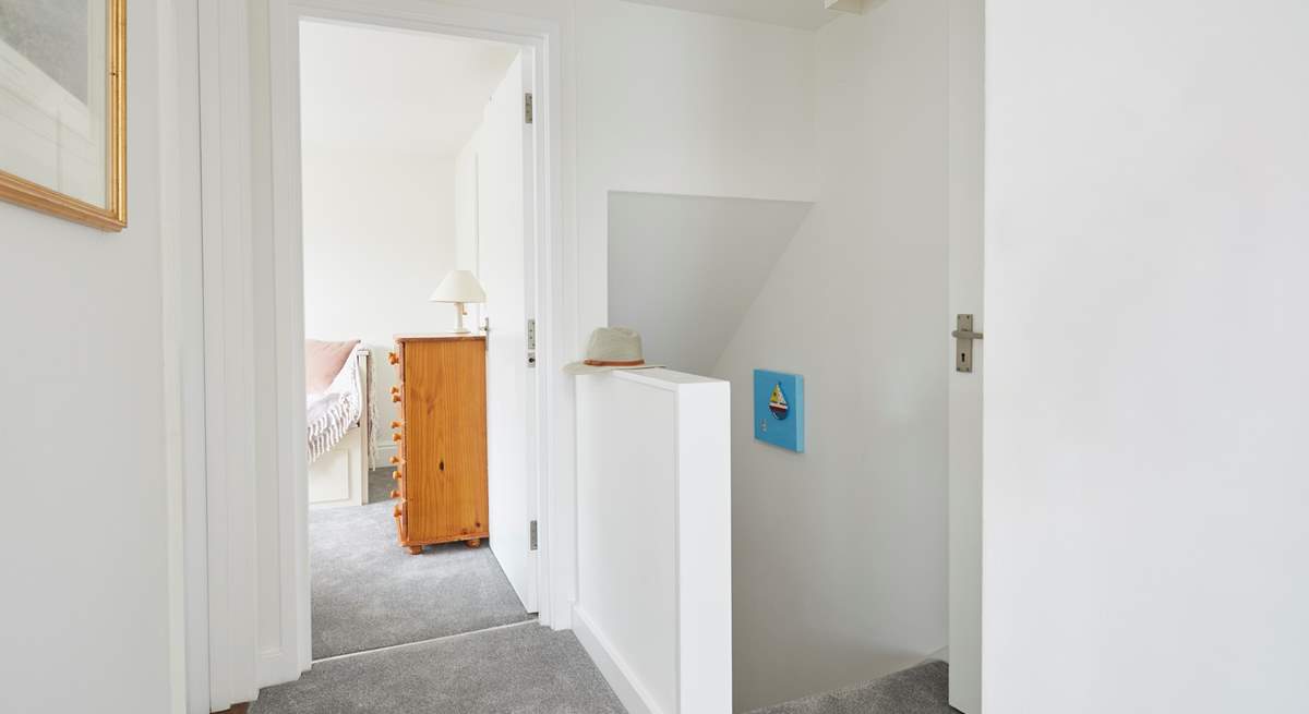 With a bathroom on this level, the first floor leads to a double and single bedroom.