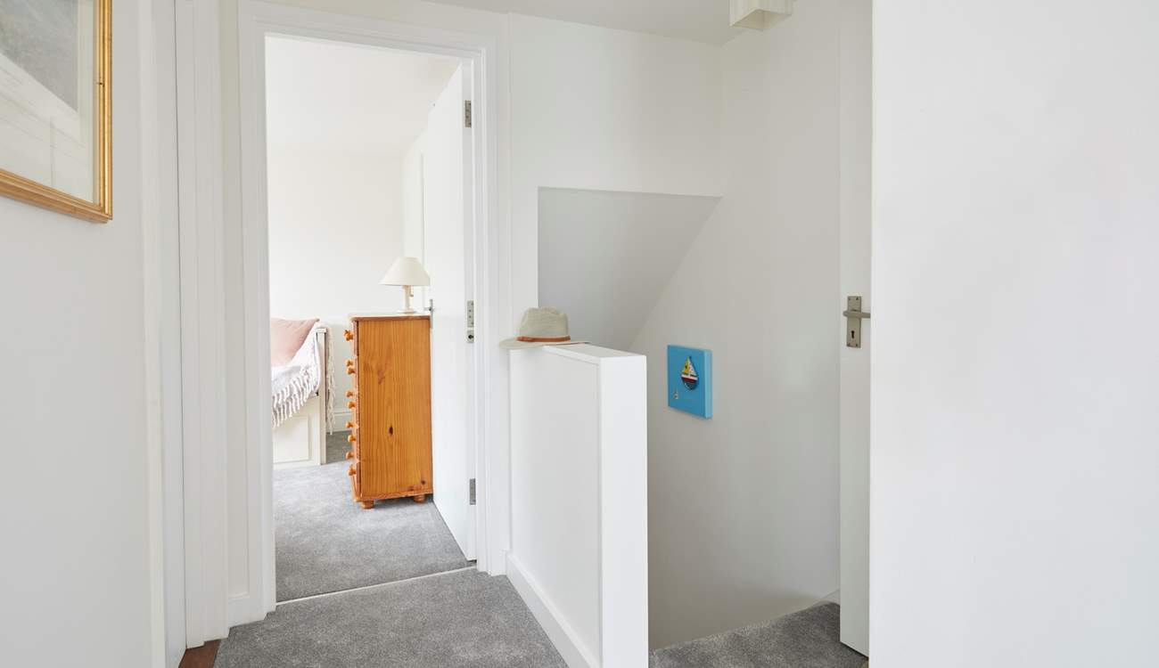 With a bathroom on this level, the first floor leads to a double and single bedroom.