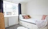 The comfortable single bedroom is cosy and full of natural light.  - Thumbnail Image
