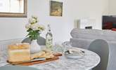 The dining area is ready for sociable mealtimes.  - Thumbnail Image