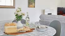 The dining area is ready for sociable mealtimes. 