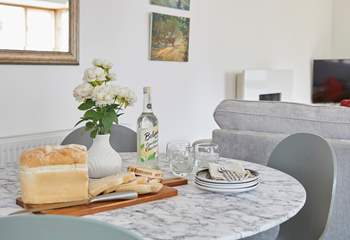 The dining area is ready for sociable mealtimes. 