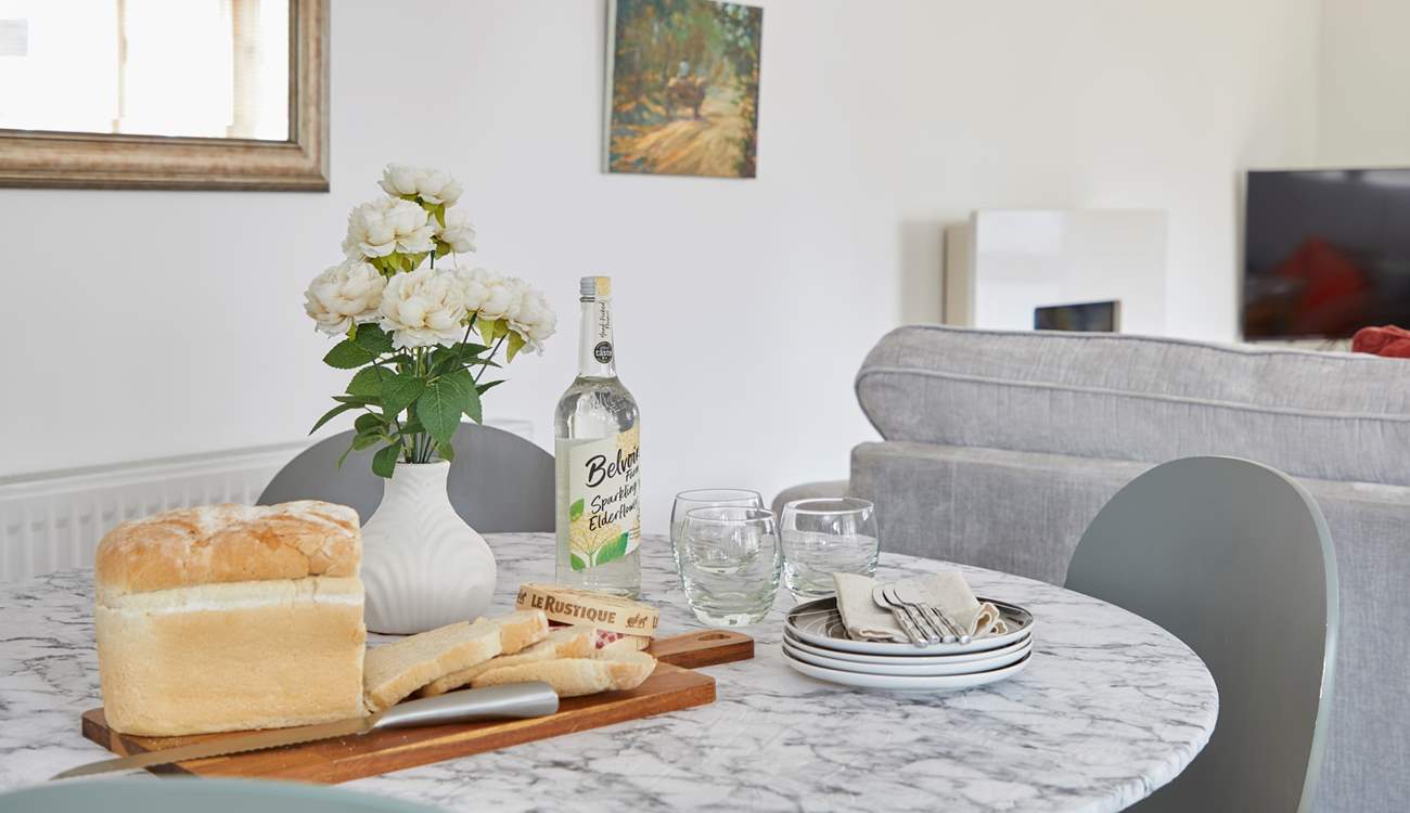 The dining area is ready for sociable mealtimes. 