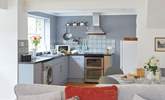 The kitchen is both modern and well-equipped to cook up a delicious meal.  - Thumbnail Image