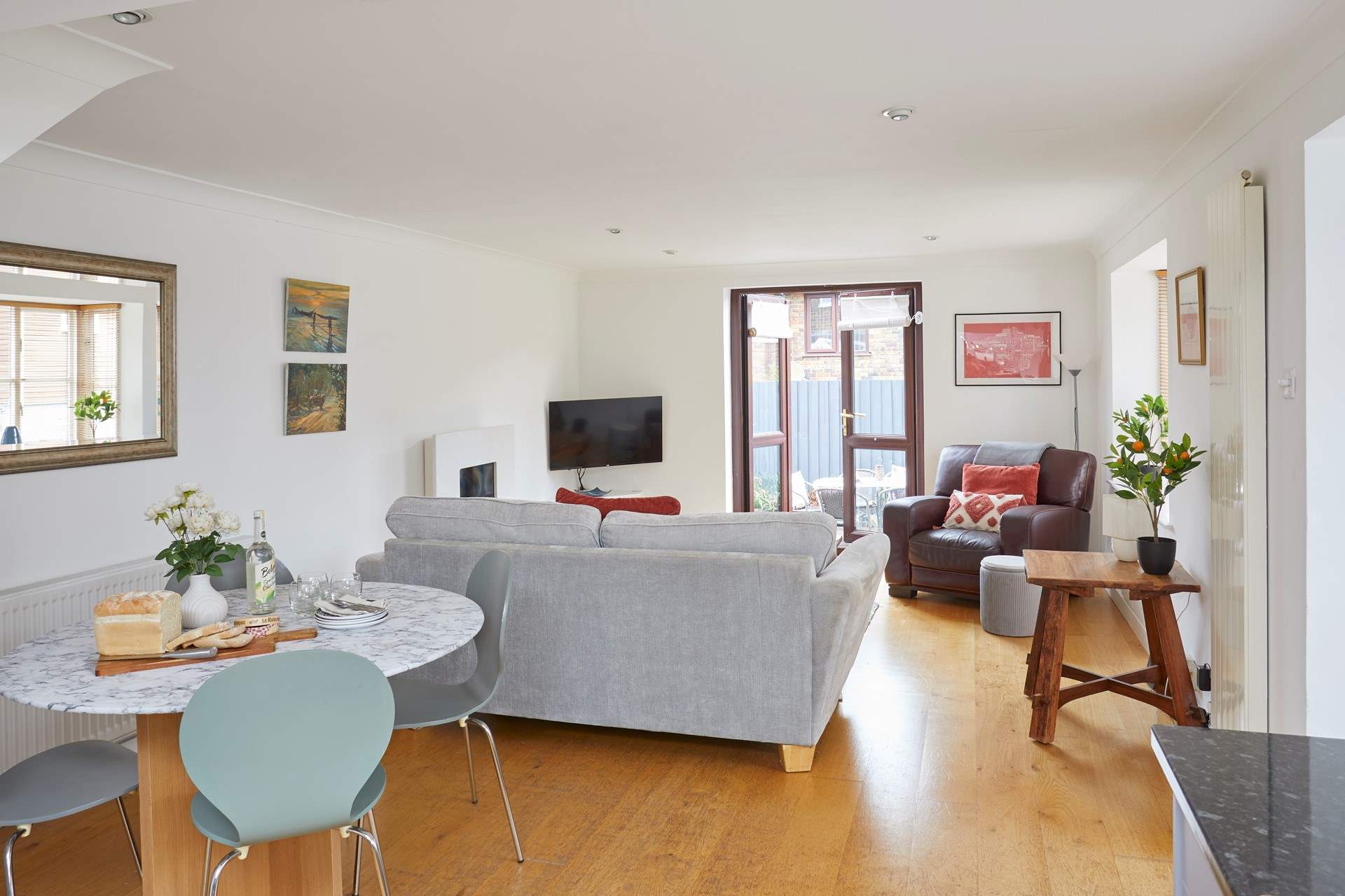 Step outside to the decked terrace from the spacious living area. 