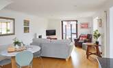 Step outside to the decked terrace from the spacious living area.  - Thumbnail Image