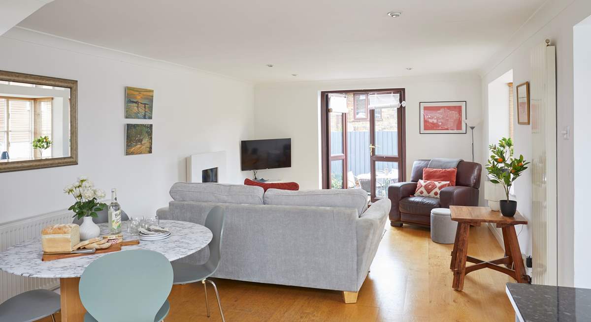 Step outside to the decked terrace from the spacious living area. 