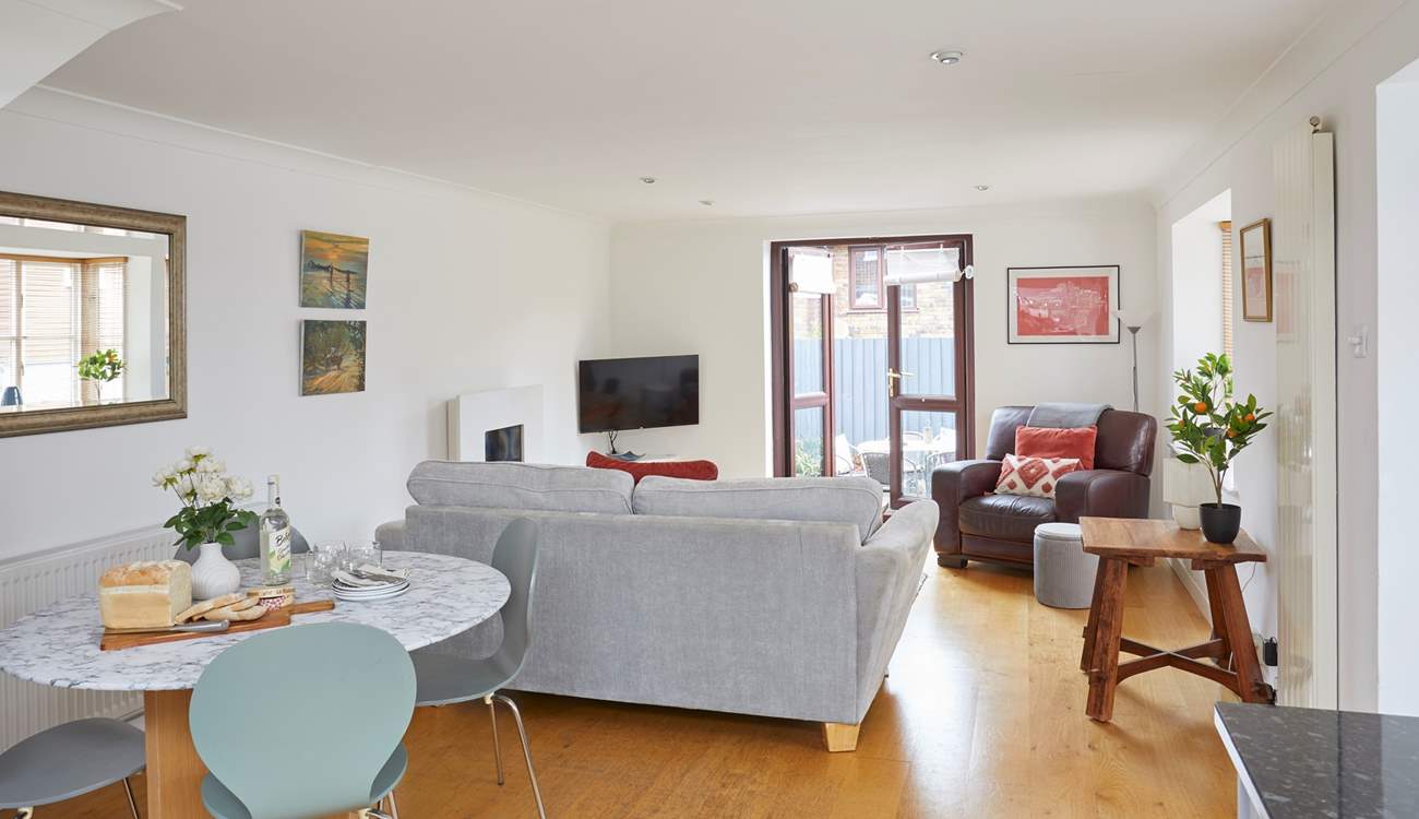 Step outside to the decked terrace from the spacious living area. 