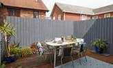 The decked terrace is fully enclosed and ready for relaxing outdoors.  - Thumbnail Image