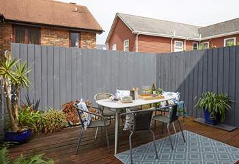 The decked terrace is fully enclosed and ready for relaxing outdoors. 