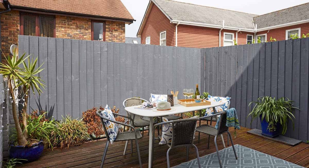 The decked terrace is fully enclosed and ready for relaxing outdoors. 
