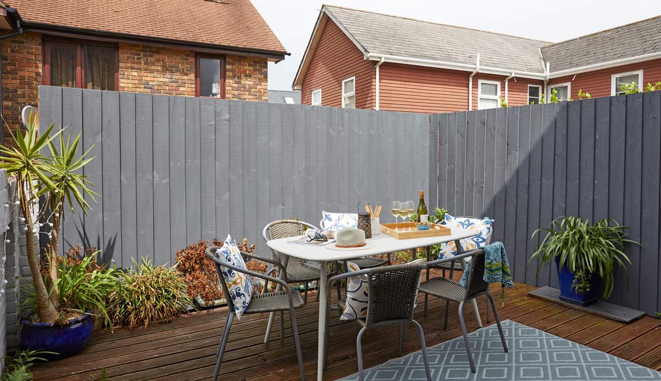 The decked terrace is fully enclosed and ready for relaxing outdoors. 