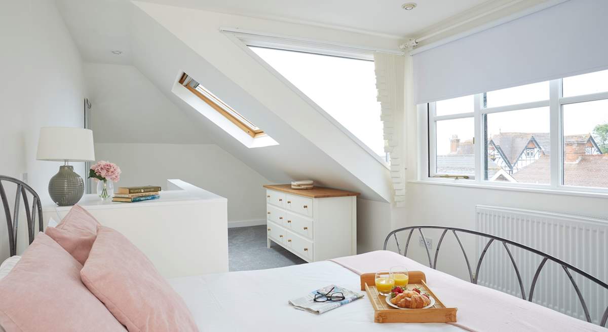 Plenty of windows allow for natural light and sea glimpses across the village rooftops. 