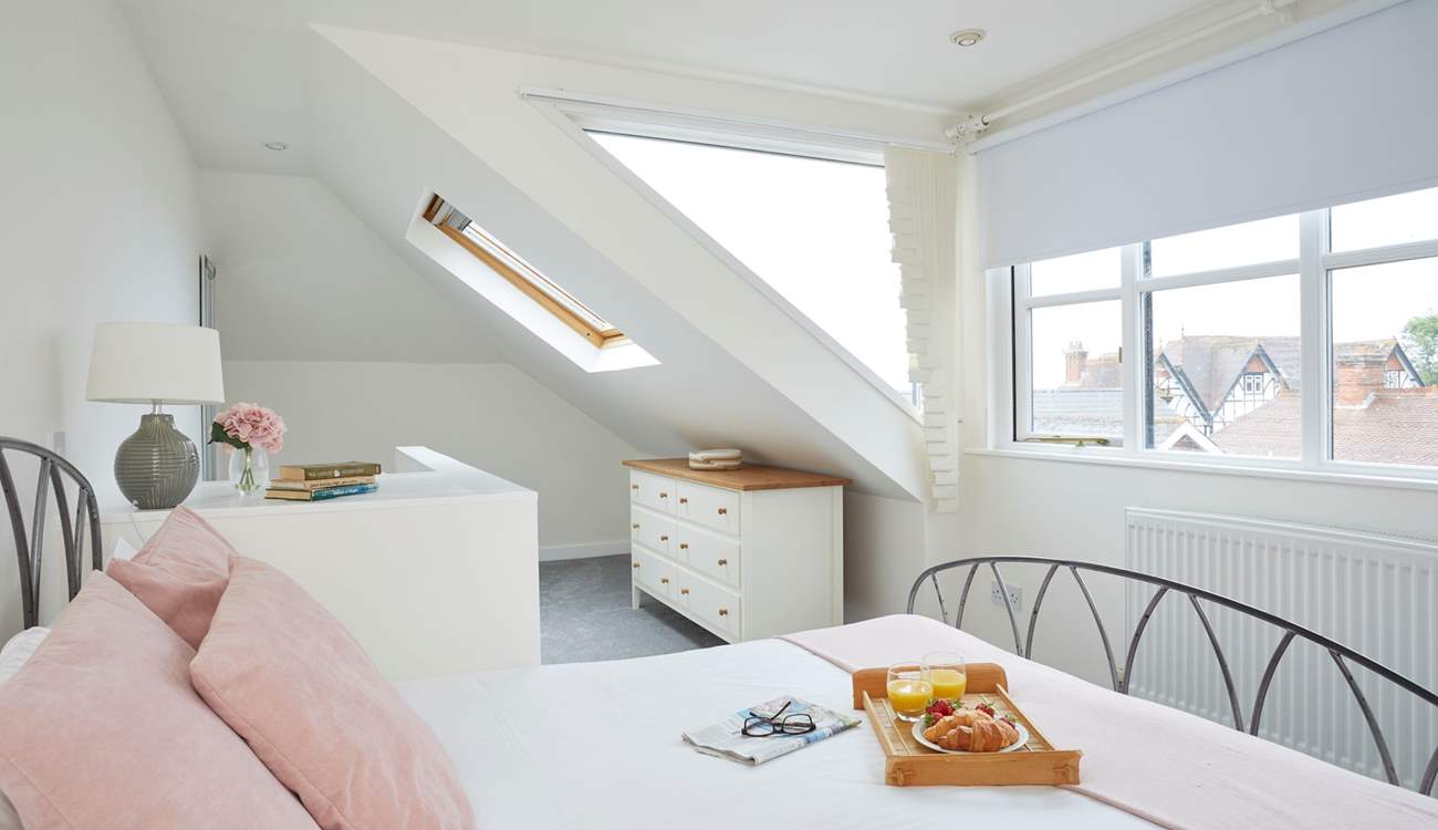 Plenty of windows allow for natural light and sea glimpses across the village rooftops. 