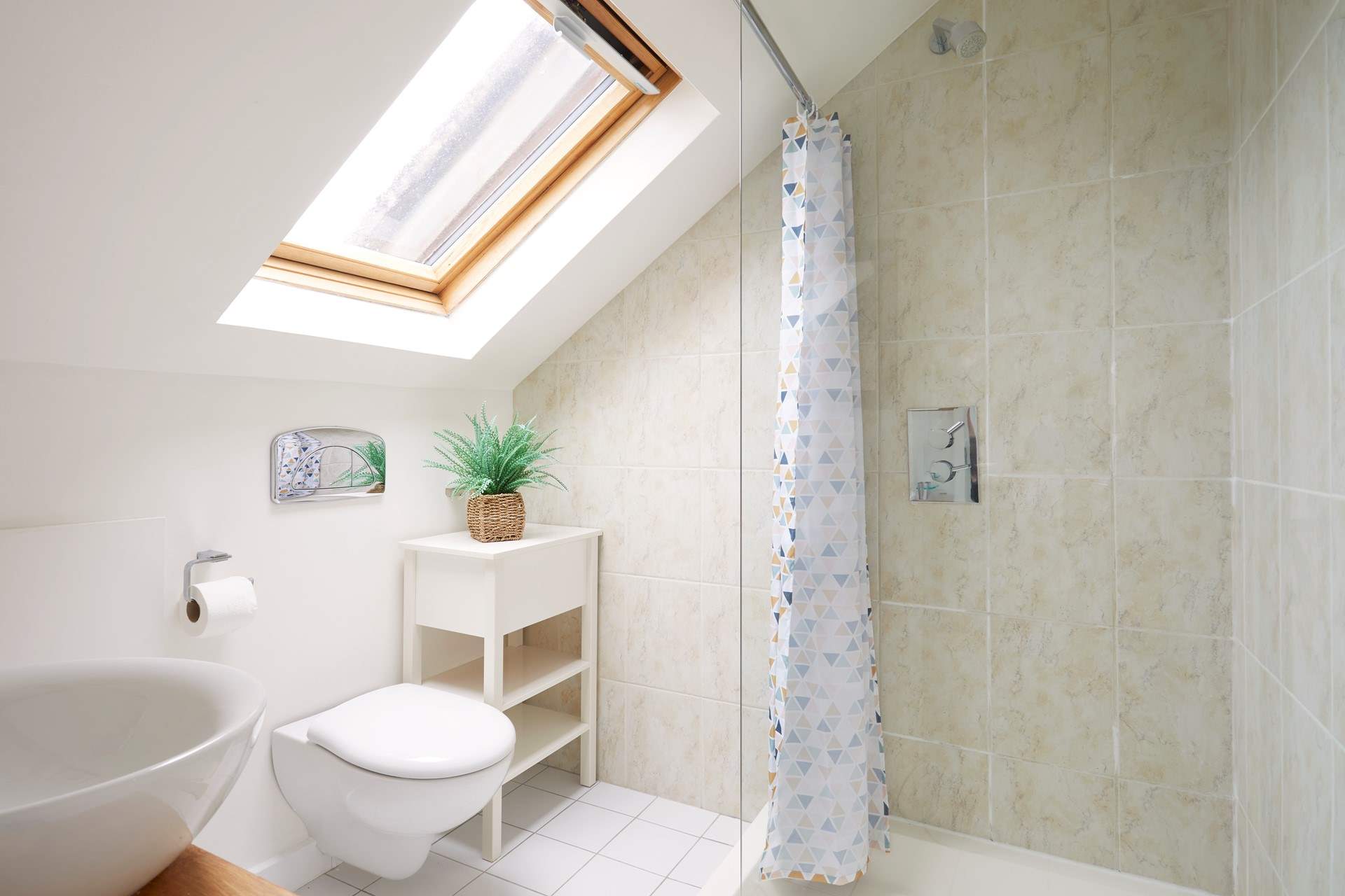 Step into the en-suite shower room to freshen up. 