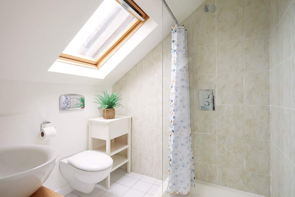 Step into the en-suite shower room to freshen up.