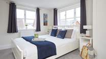 The inviting double bedroom on the first floor is bathed in natural light. 