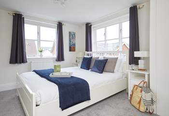The inviting double bedroom on the first floor is bathed in natural light. 