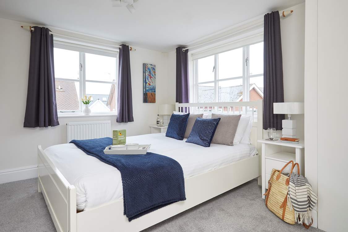 The inviting double bedroom on the first floor is bathed in natural light.