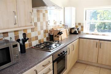 The kitchen is fully equipped and modern.