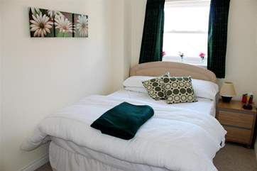 The comfortable main bedroom.
