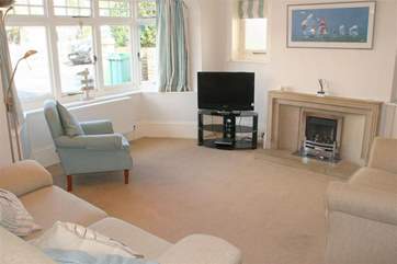 One of two pleasant sitting-rooms that offer ample space for the entire family.
