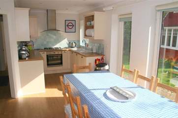The kitchen/dining-room opens out to a lovely private enclosed garden.
