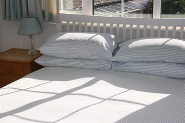 The first floor double bedroom overlooks the pretty private garden.