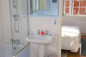 The Jack and Jill bathroom on the first floor provides a shower over the bath.