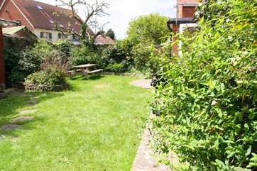 The leafy private garden is fully enclosed, ideal for active young children and pets.