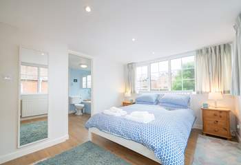 The first floor double bedroom overlooks the pretty private garden.