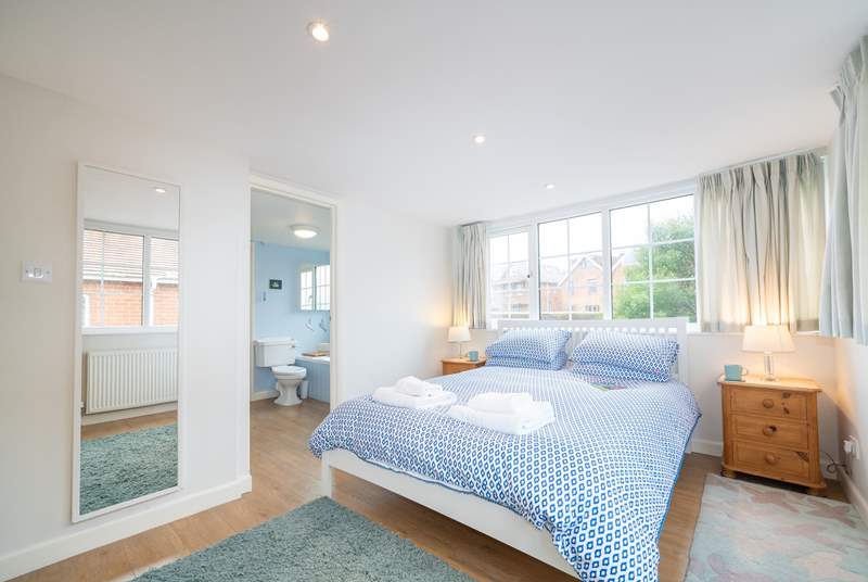The first floor double bedroom overlooks the pretty private garden.